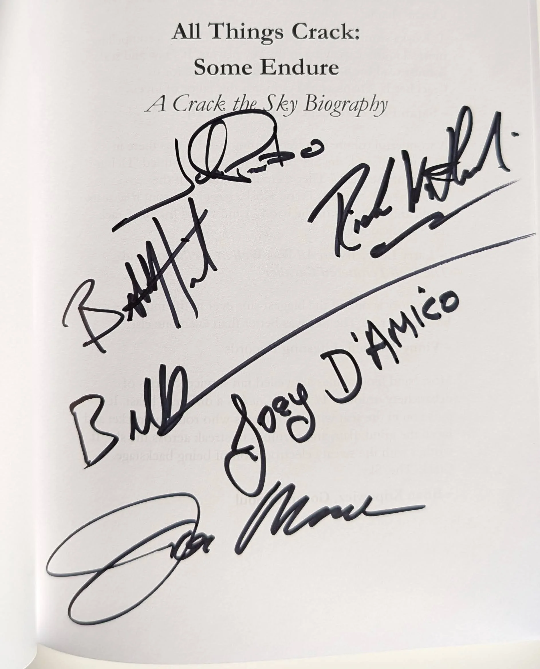Premium Paperback: Signed by the Band